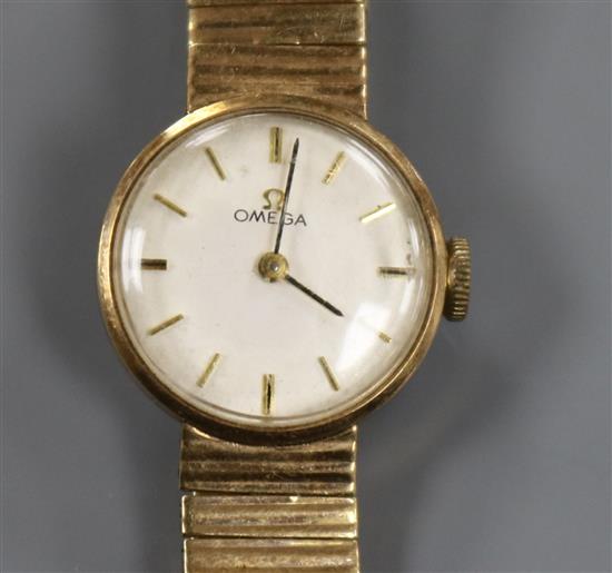 A ladys 9ct gold Omega manual wind wrist watch on 9ct gold Omega bracelet.